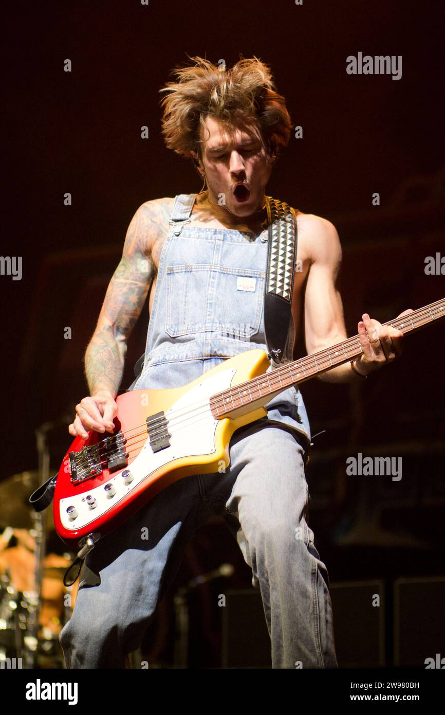 Dougie Poynter of band McFly playing bass at Newmarket Racecourse Stock Photo