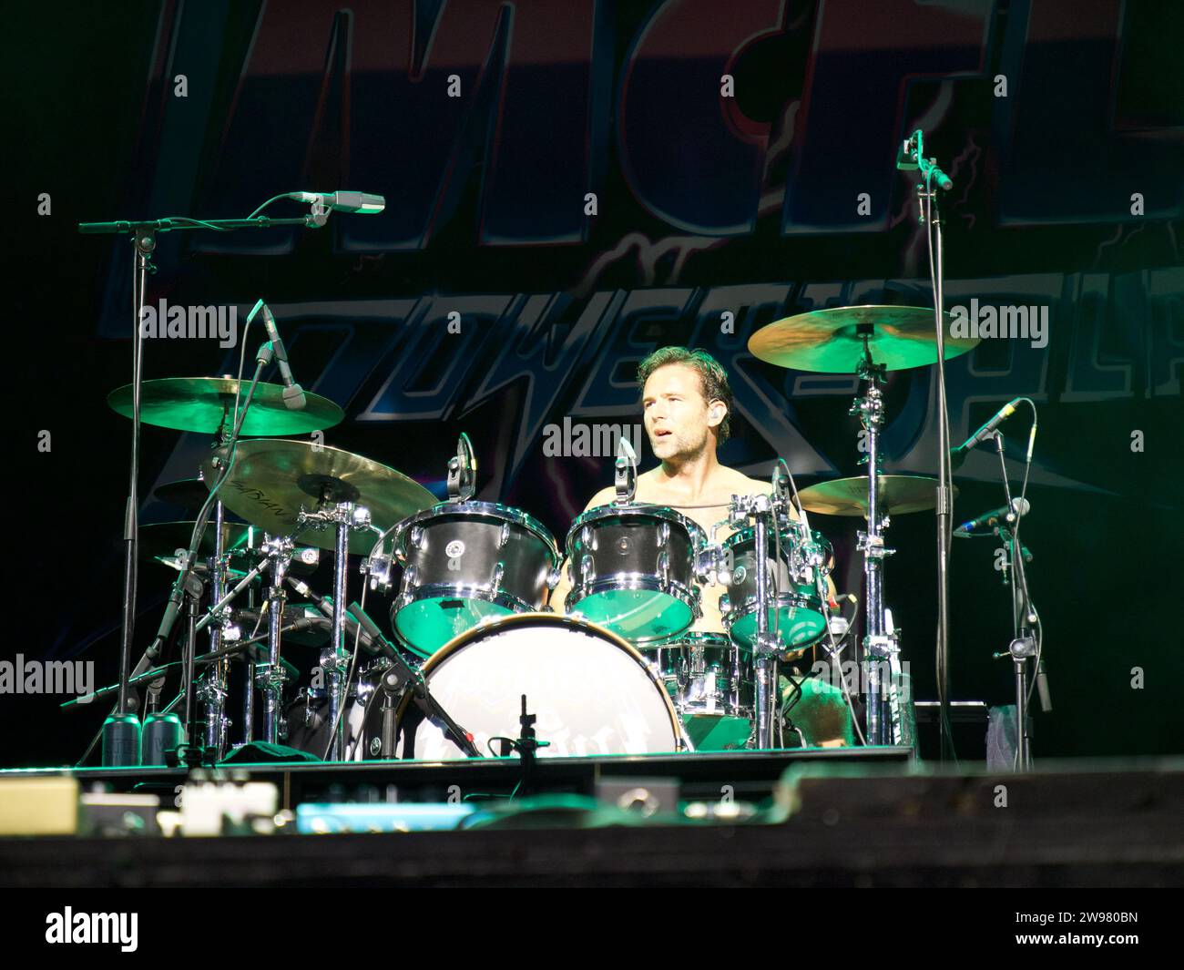 Harry Judd of band McFly playing drums at Newmarket Racecourse Stock Photo