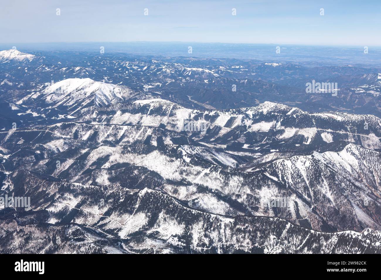 Aerial view of the snow capped mountains in the winter. Snow covered ...