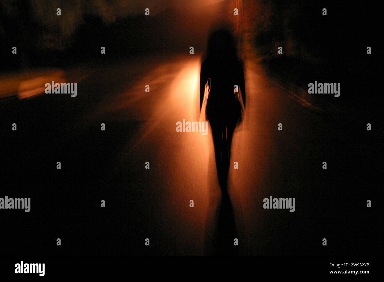 Woman street night rear view hi-res stock photography and images - Alamy