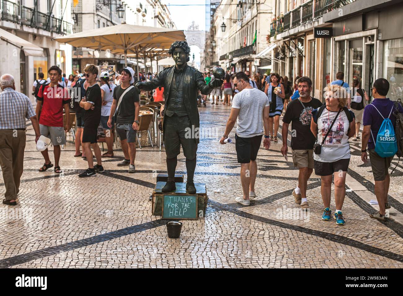 Black painted mime artist on street at Commerce Square in Lisbon Stock Photo