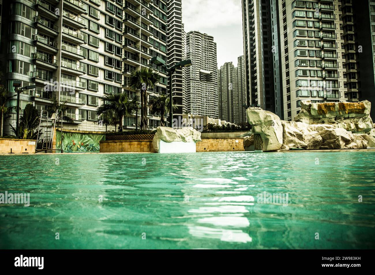 Swimming pool and apartment blocks. Stock Photo