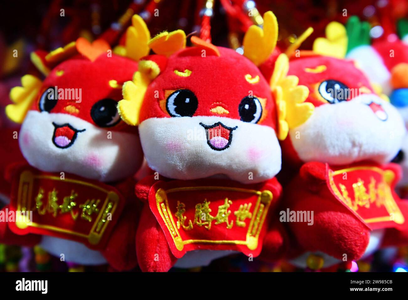 QINGDAO, CHINA - DECEMBER 25, 2023 - Dolls of the Year of the Dragon are displayed for sale at Duoyuan Mall in Qingdao, East China's Shandong province Stock Photo