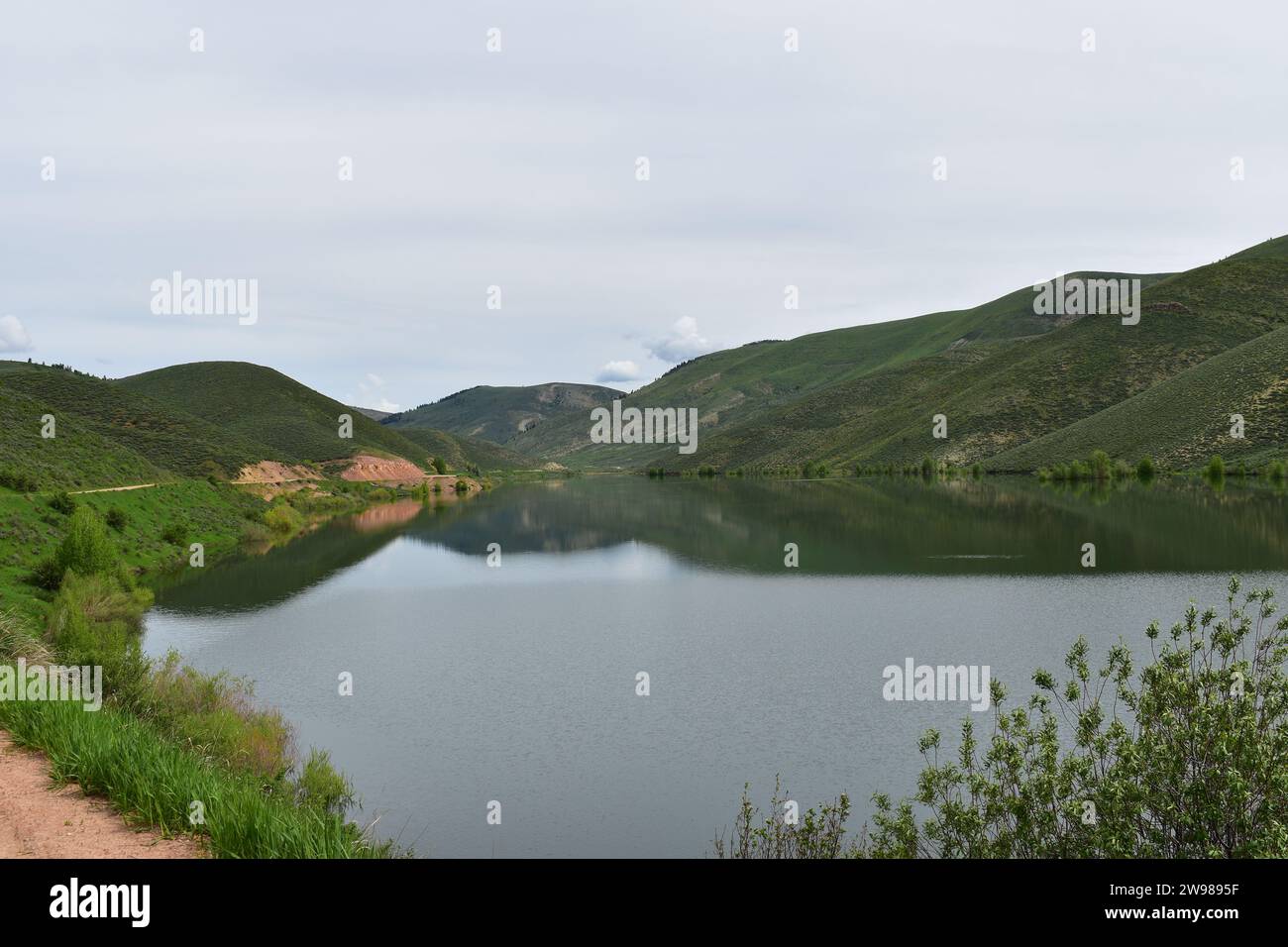 Beautiful scenery of still water and grass hills at the Montpellier ...