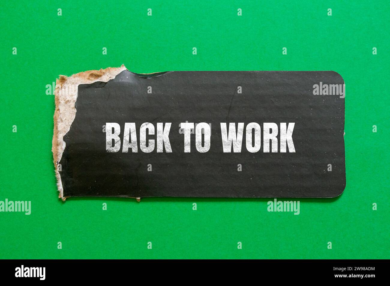Back to work lettering on ripped paper. Business concept photo. Stock Photo