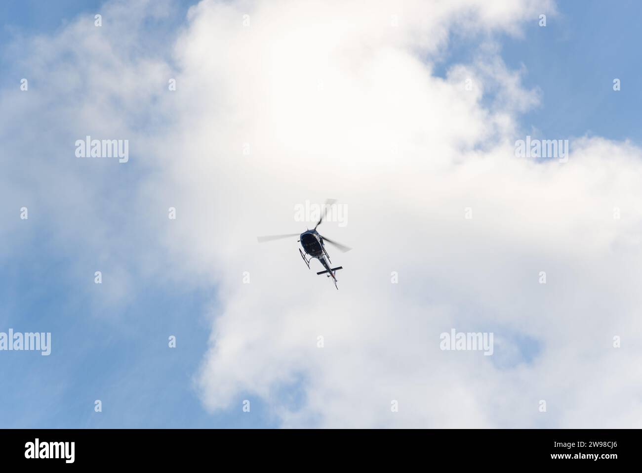 Salvador, Bahia, Brazil - April 26, 2019: A military police helicopter flying over Jaguaribe beach in the city of Salvador, Bahia. Stock Photo