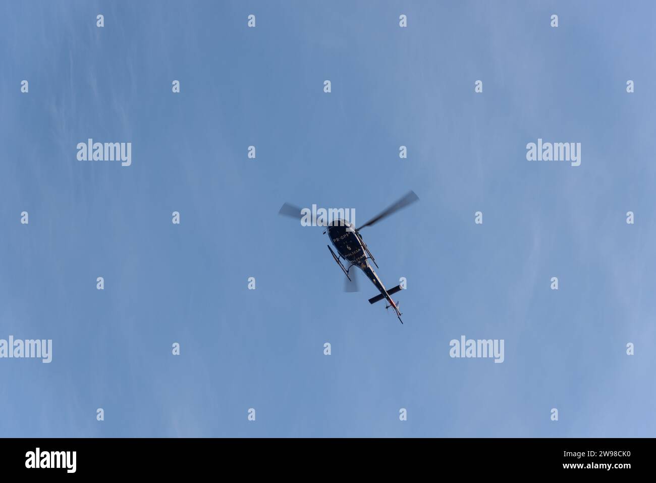 Salvador, Bahia, Brazil - April 26, 2019: Military police helicopter is seen flying over Jaguaribe beach in the city of Salvador, Bahia. Stock Photo