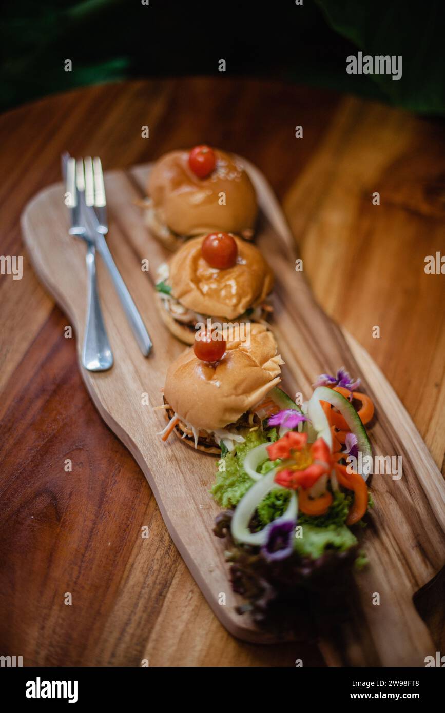 A plate of food on a wood surface Stock Photo