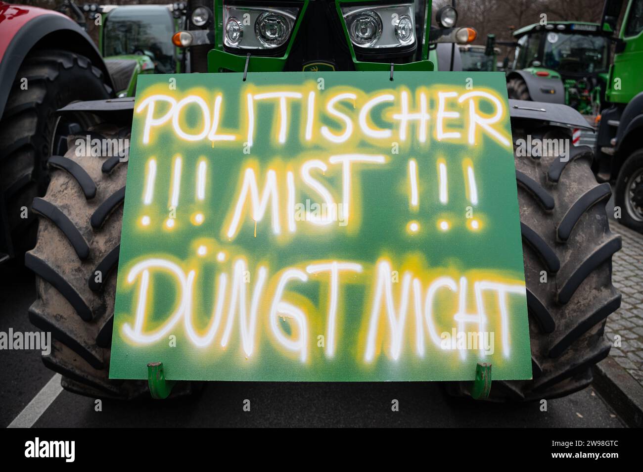 18.12.2023, Berlin, Germany, Europe - Thousands of farmers demonstrate with their tractors against austerity policy in front of the Brandenburg Gate. Stock Photo