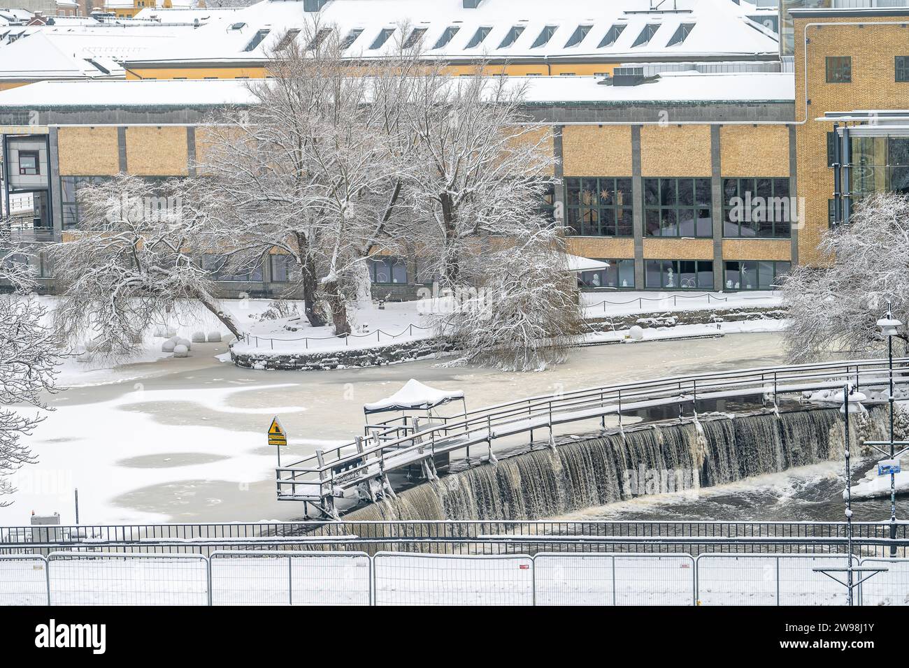 Christmas Day 2023: A White Christmas in the industrial landscape of Norrkoping. Norrkoping is a historic industrial town in Sweden. Stock Photo