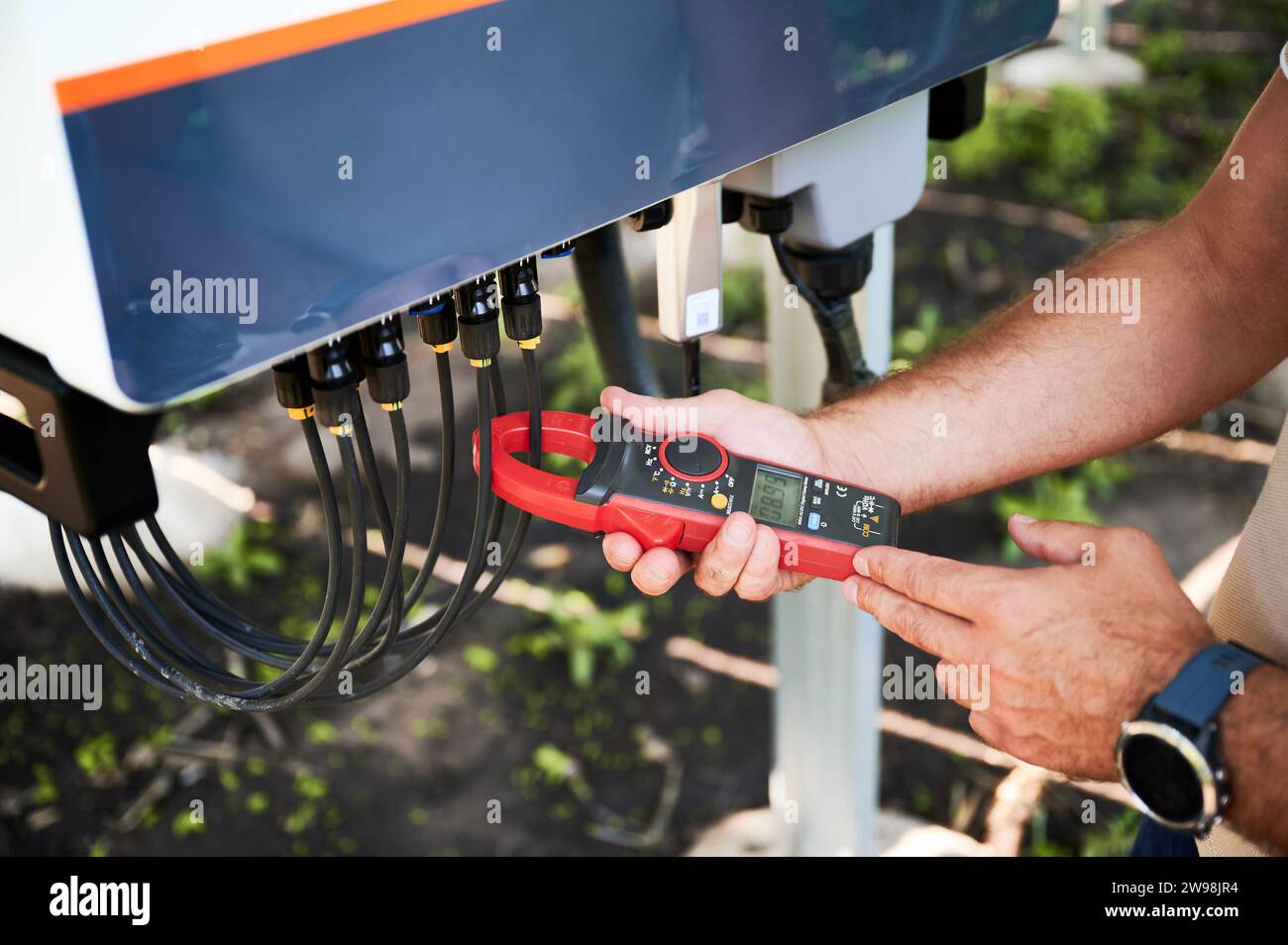 Inspector checking output voltage level of inverter. Professional