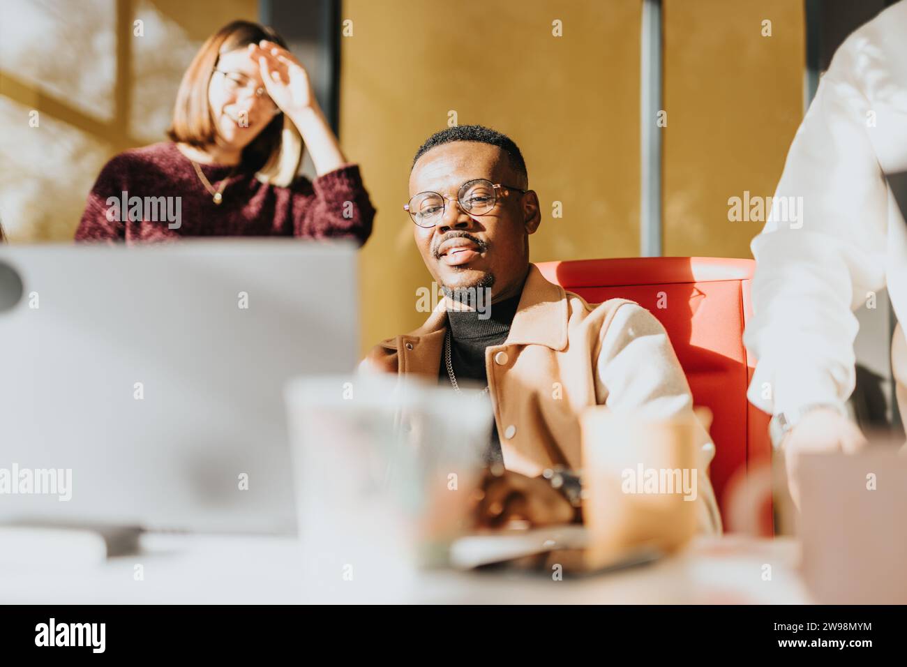 Diverse team strategizing and collaborating in a modern office for a ...