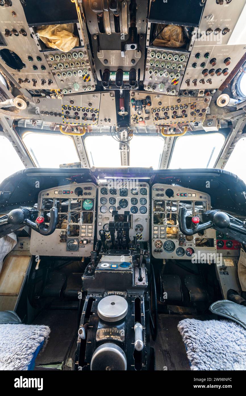 Interior, a decommissioned RAF 1970's Hawker Siddeley Nimrod, a retired maritime patrol aircraft. The cockpit with pilot and co-pilot's seats. Stock Photo