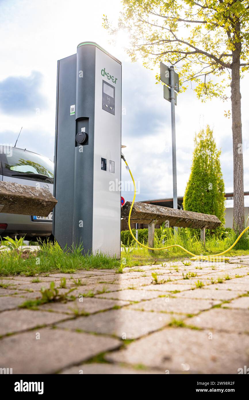 Electric vehicle charging station outside with surrounding nature and