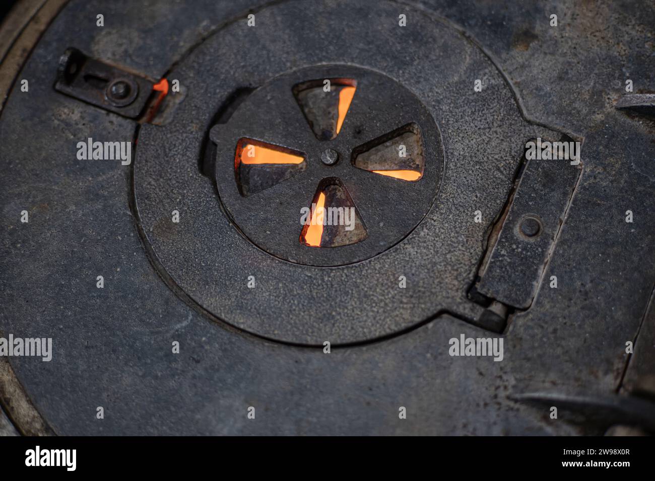 Traditional cast stove detail. Old metal and traditional cast iron hot