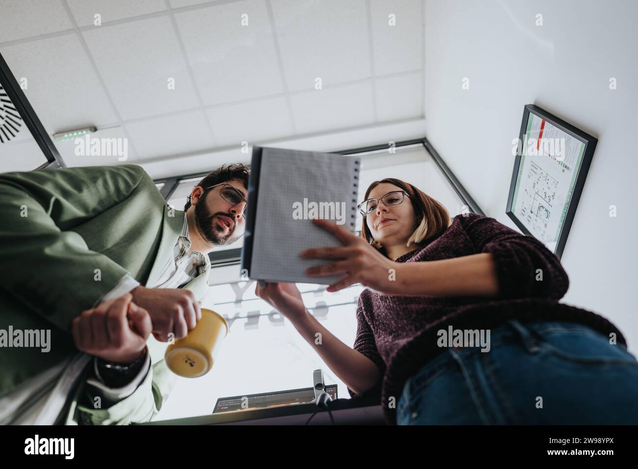 Business colleagues collaborating on a new project in a creative office. Stock Photo