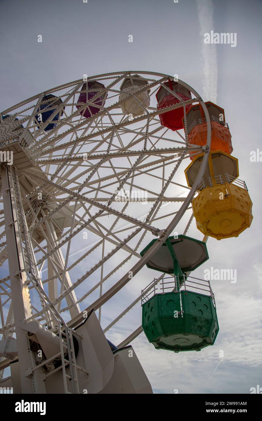 An aerial view of a vibrant-colored amusement park Ferris wheel in Tibidabo,Barcelona Stock Photo