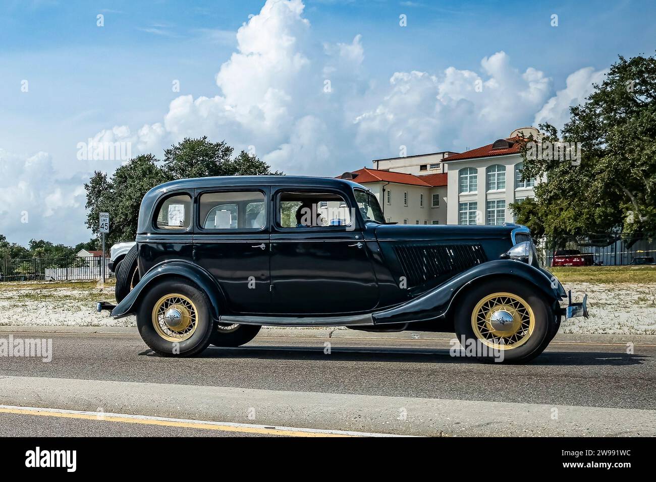 Gulfport, MS October 05, 2023 Wide angle side view of a 1934 Ford V8 Fordor Sedan at a local