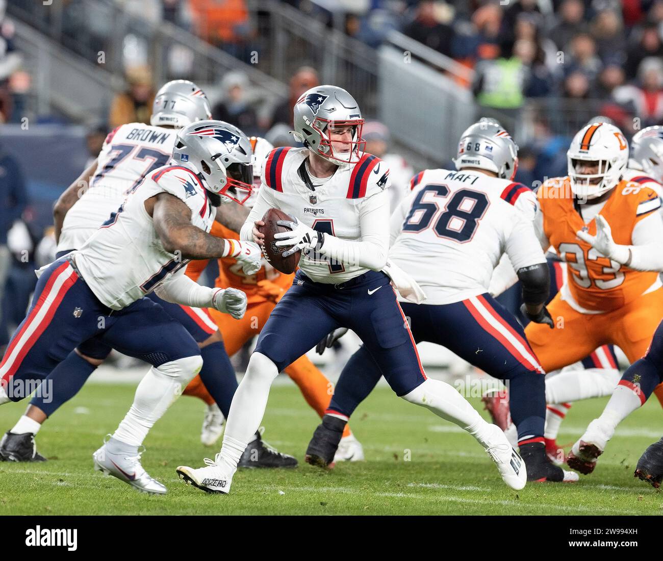 Denver, Colorado, USA. 24th Dec, 2023. Patriots QB BAILEY ZAPPE readies to throw the ball during the 1st. Half Sunday night at Empower Field at Mile High in Denver, CO. The Patriots beat the Broncos 26-23. (Credit Image: © Hector Acevedo/ZUMA Press Wire) EDITORIAL USAGE ONLY! Not for Commercial USAGE! Stock Photo
