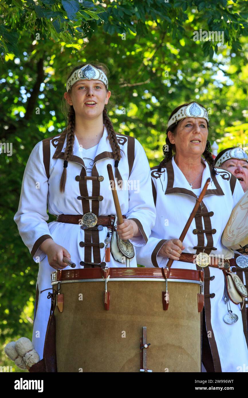 A Hungarian girl of a folk ensemble throat singing at a folk festival in the City Park of Budapest, Hungary Stock Photo