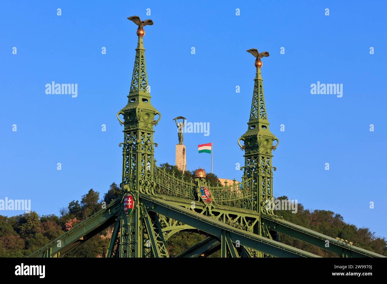 The Liberty Bridge (Szabadsag Hid) with the Liberty Statue at the Citadel (Citadella) as a backdrop in Budapest, Hungary Stock Photo