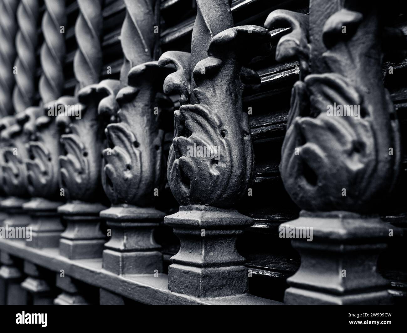 A closeup of black wrought window bars of an old palace in Seville, Andalusia, Spain Stock Photo