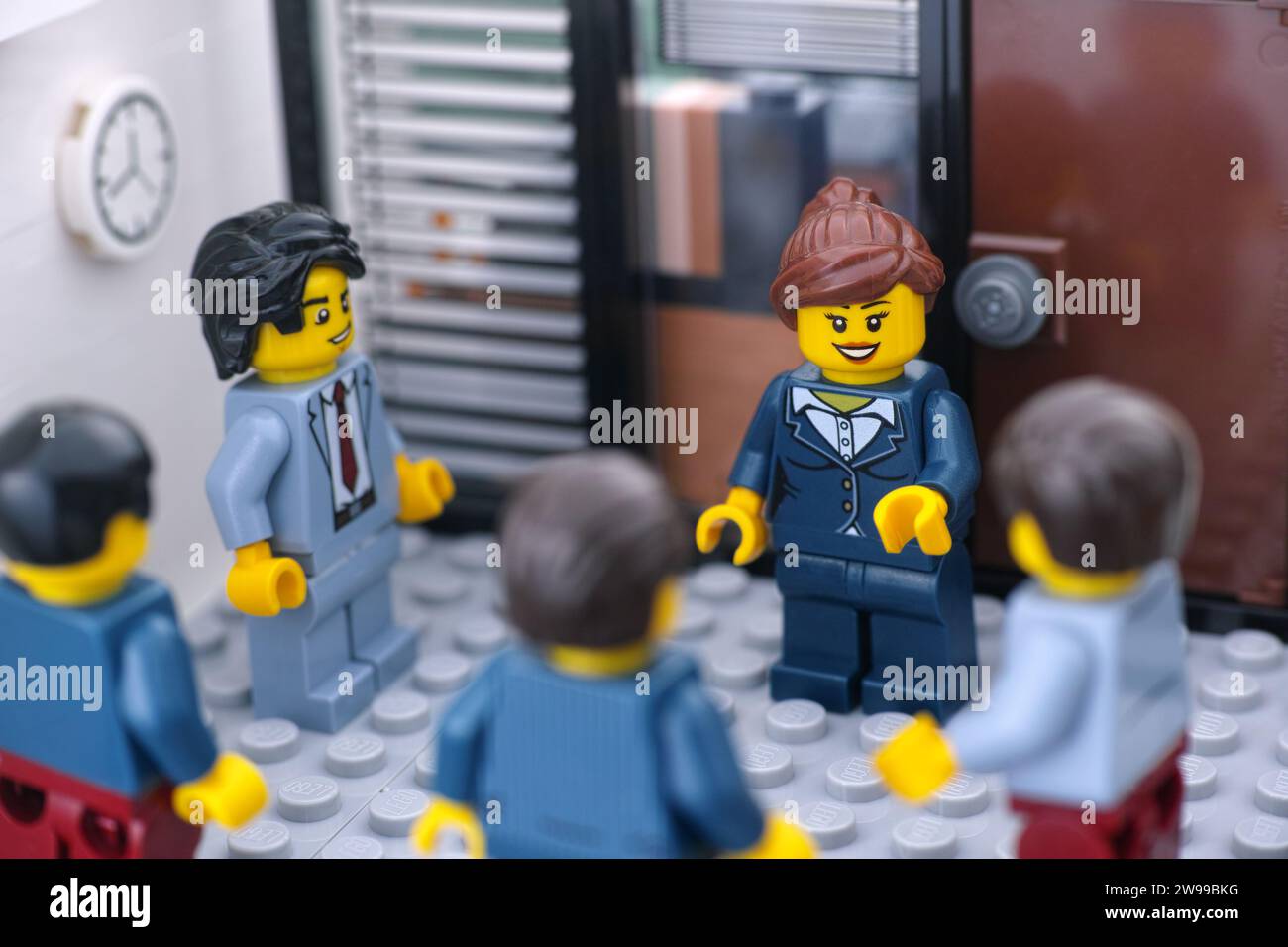 Tambov, Russian Federation - December 25, 2023 Lego businesspeople minifigures having a meeting in a meeting room. Stock Photo