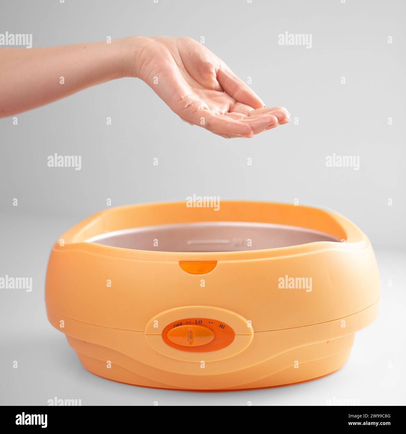 Hand dipped container with paraffin. Paraffin Therapy.Treat those with