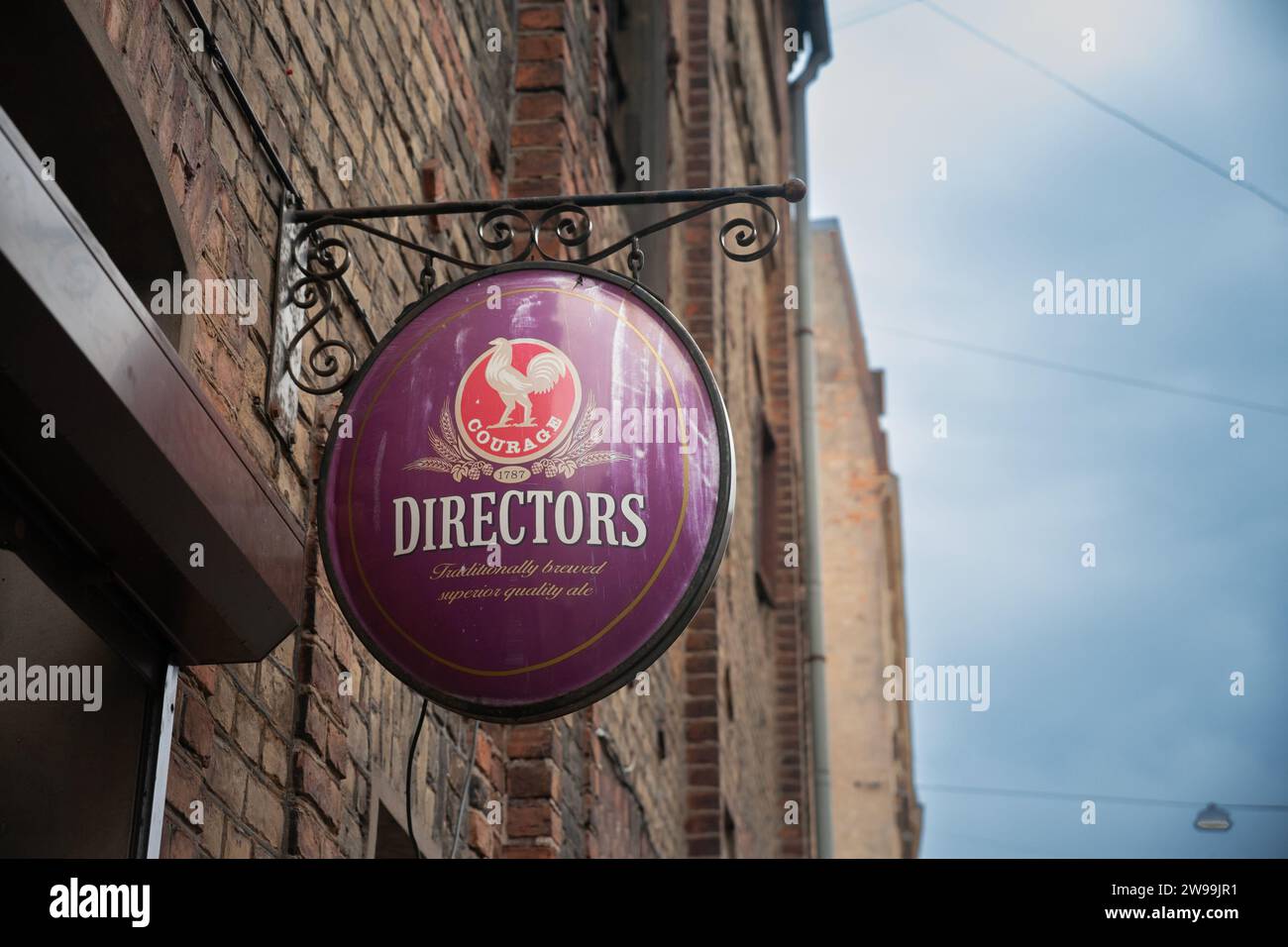 Picture of a sign with the logo of Courage Directors Beer on a retailer in Riga, Latvia. Stock Photo
