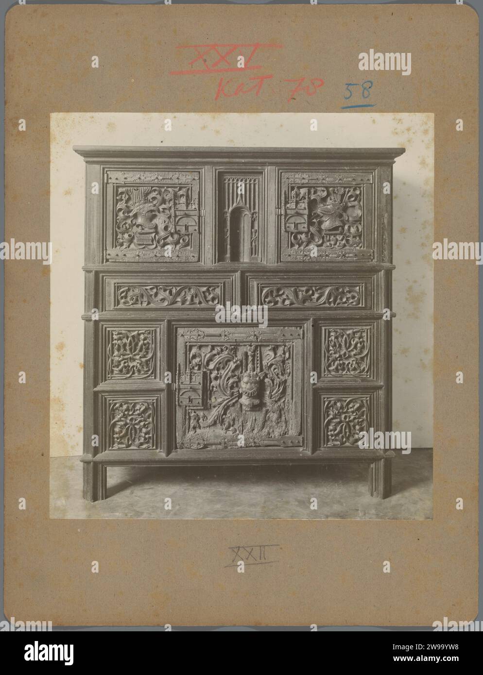 Cupboard with cut ornaments of plant motifs, animal heads and satan, c. 1875 - c. 1900 photograph  Europe cardboard. photographic support gelatin silver print cupboard. devil(s) and demons: Satan. ornament derived from plant forms. ornament  hybrid animals Europe Stock Photo