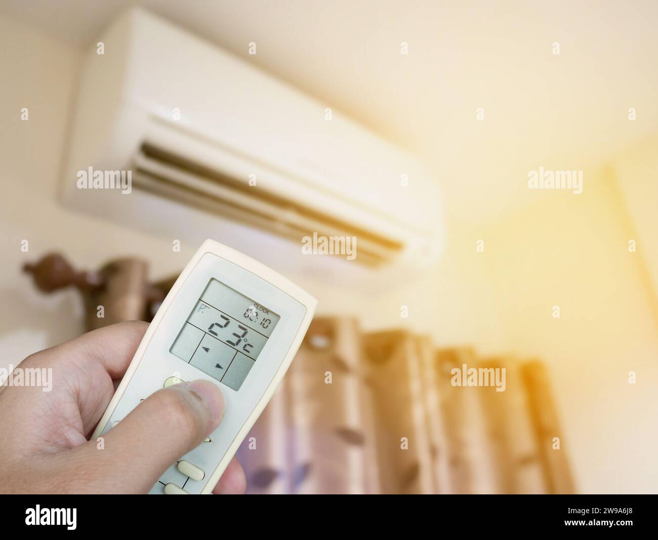 Remote Control Opened Up Hand hold remote control open the air conditioner Stock Photo - Alamy