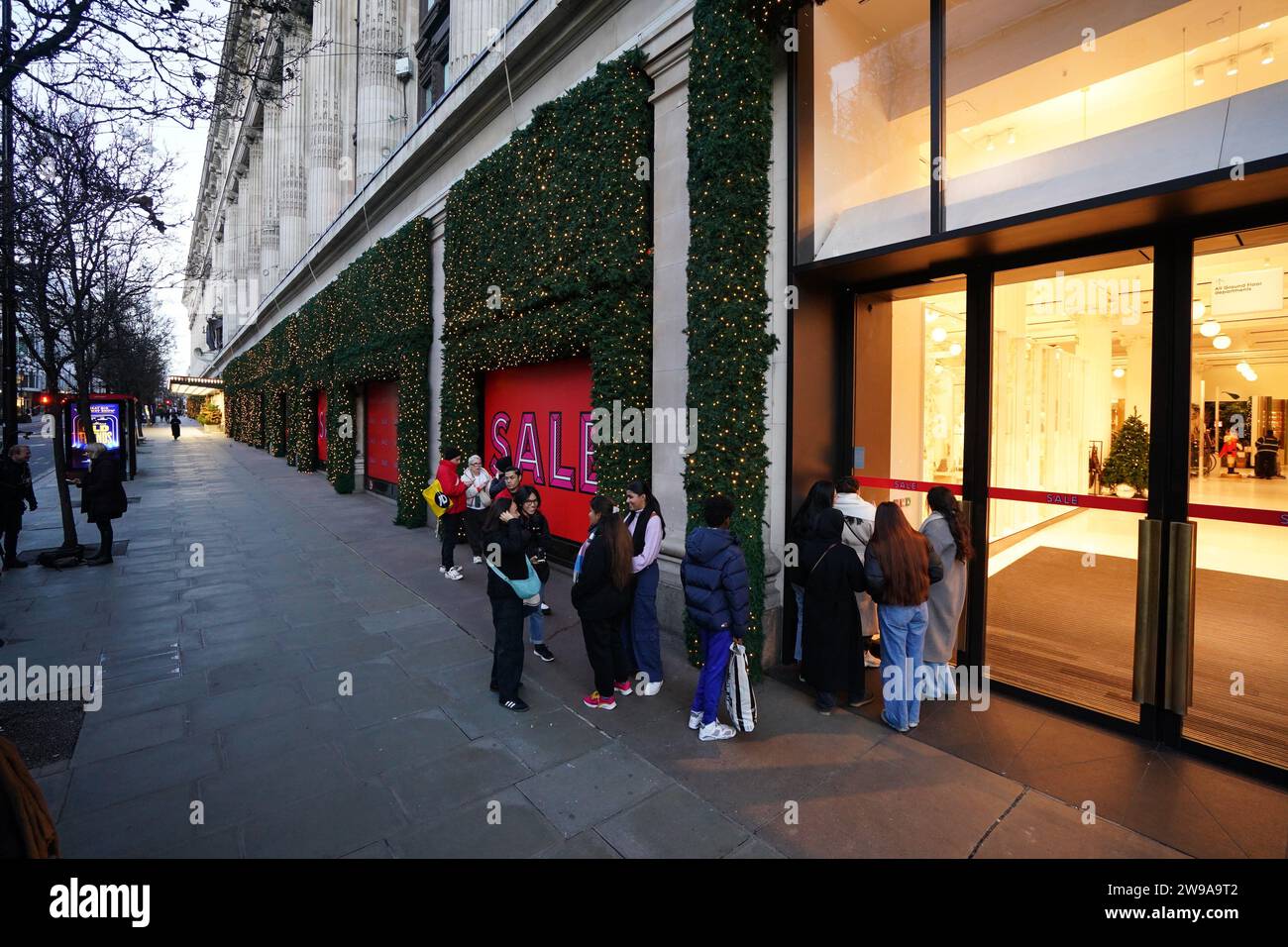 A small line of shoppers queueing at 8.12am outside Selfridges