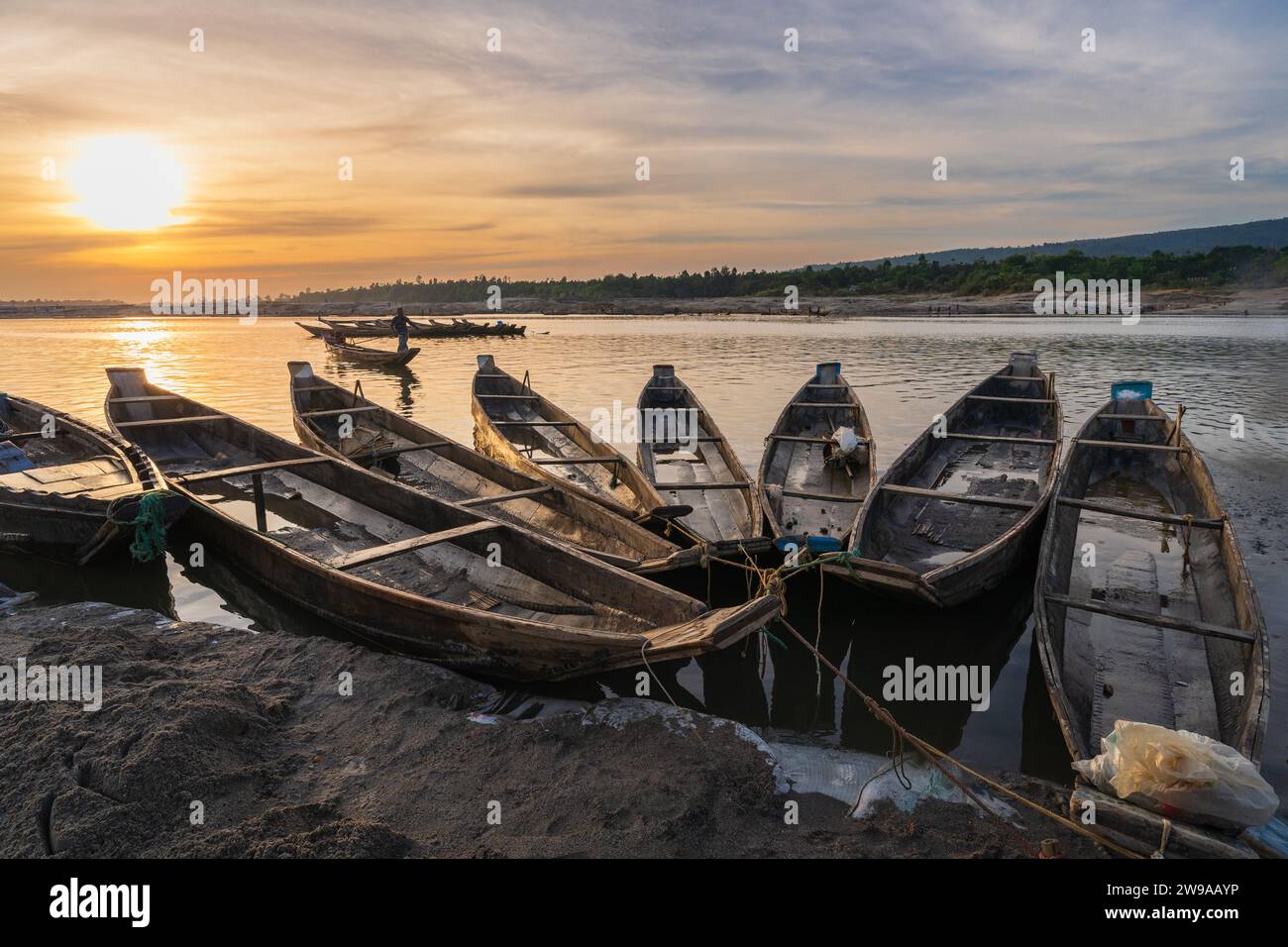 Landscape view of wooden boats on river bank at sunset, Jaflong, Bangladesh Stock Photo
