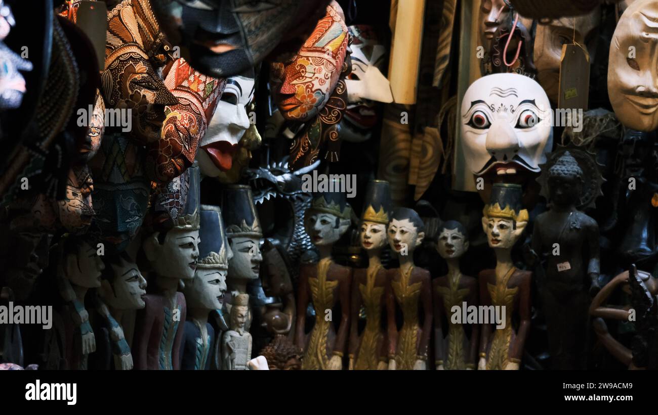 An array of carnival masks and small figurines Stock Photo
