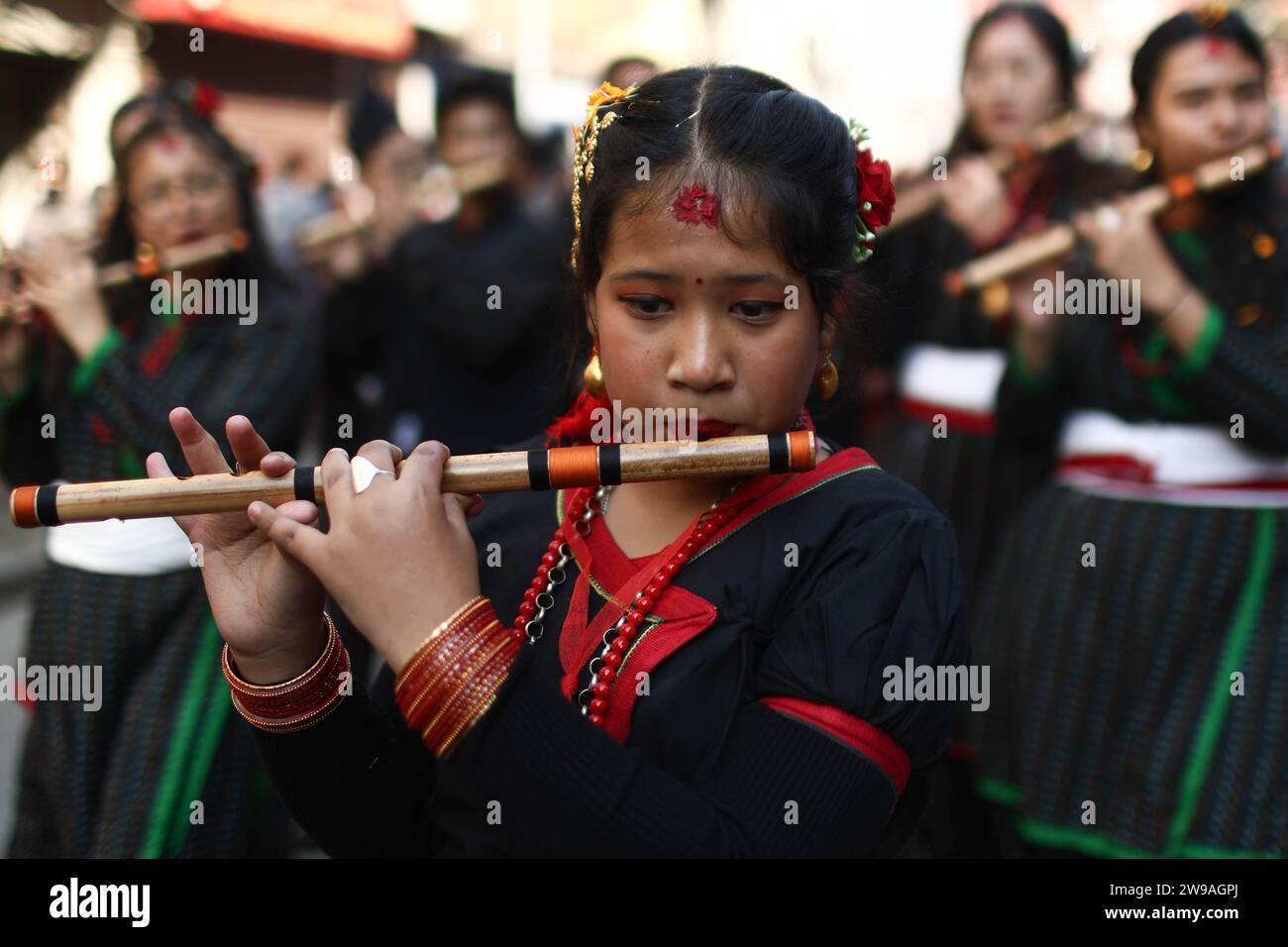 Kathmandu, Nepal. 26th Dec, 2023. Girls in traditional attire play