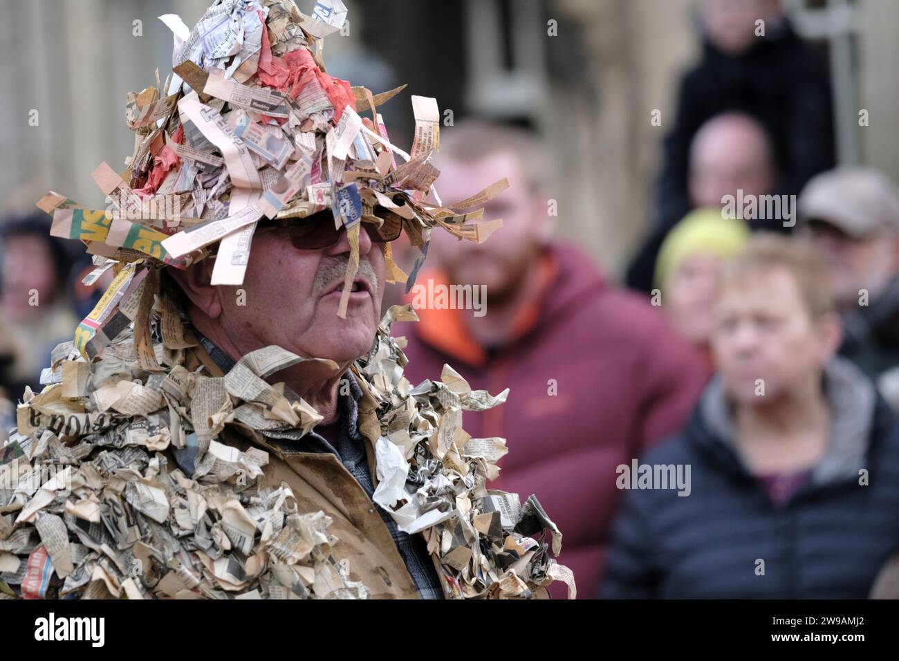Marshfield, Glos, UK. 26th Dec, 2023. The Marshfield Paper Boys perform a traditional Mummers play on Boxing Day in the village. The players or Mummers get their name from the strips of paper sewn onto their costumes, the origin is ancient and obscure. Rigidly obeying the oral tradition each player has learnt his part from another Mummer without resorting to a written text. Characters are King William, Little Man John, Dr Finnix, Tenpenny Nit, Beelzebub and Saucy Jack. Credit: JMF News/Alamy Live News Stock Photo