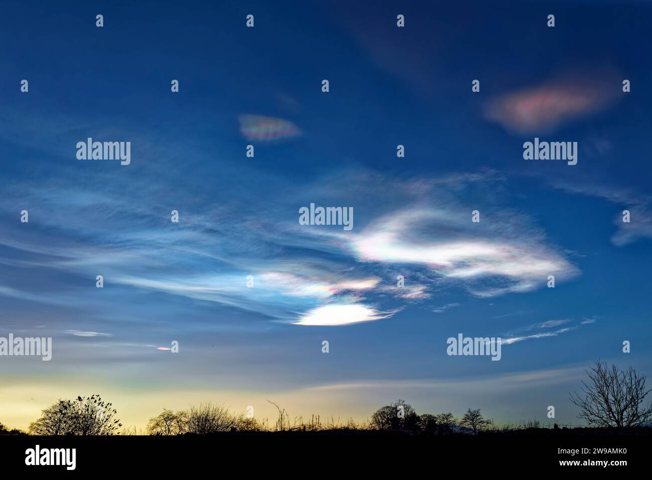 Colourful Iridescent Nacreous Clouds forming above Arbroath in the Upper Atmosphere on a cold Christmas Eve. Stock Photo