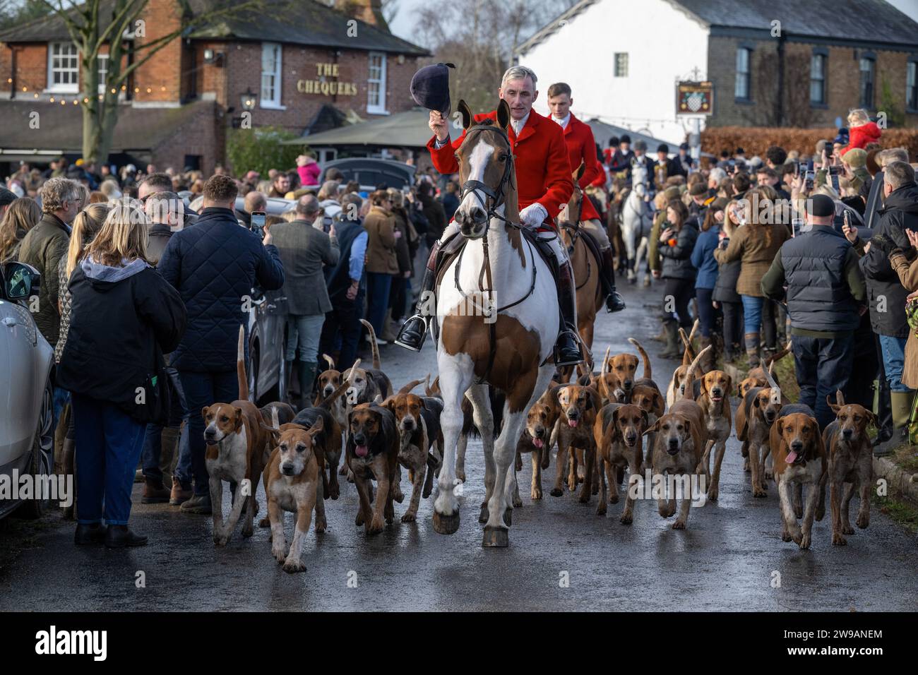 Essex, UK. 26th Dec, 2023. Hundreds of people attend as the Essex with Farmers and Union Hunt sets off for it's annual Boxing Day ride from the Chequers Pub in the rural Essex village of Matching Green UK. The Essex Hunt has met regularly in Matching Green since the early 19th century, although since the 2004 Hunting Act it has not been allowed to use dogs to chase and kill foxes. Credit: MARTIN DALTON/Alamy Live News Stock Photo