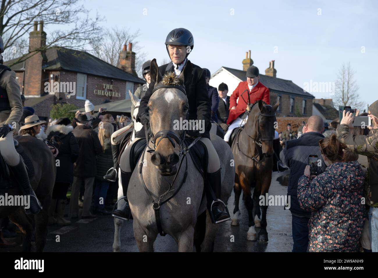 Essex, UK. 26th Dec, 2023. Hundreds of people attend as the Essex with Farmers and Union Hunt sets off for it's annual Boxing Day ride from the Chequers Pub in the rural Essex village of Matching Green UK. The Essex Hunt has met regularly in Matching Green since the early 19th century, although since the 2004 Hunting Act it has not been allowed to use dogs to chase and kill foxes. Credit: MARTIN DALTON/Alamy Live News Stock Photo