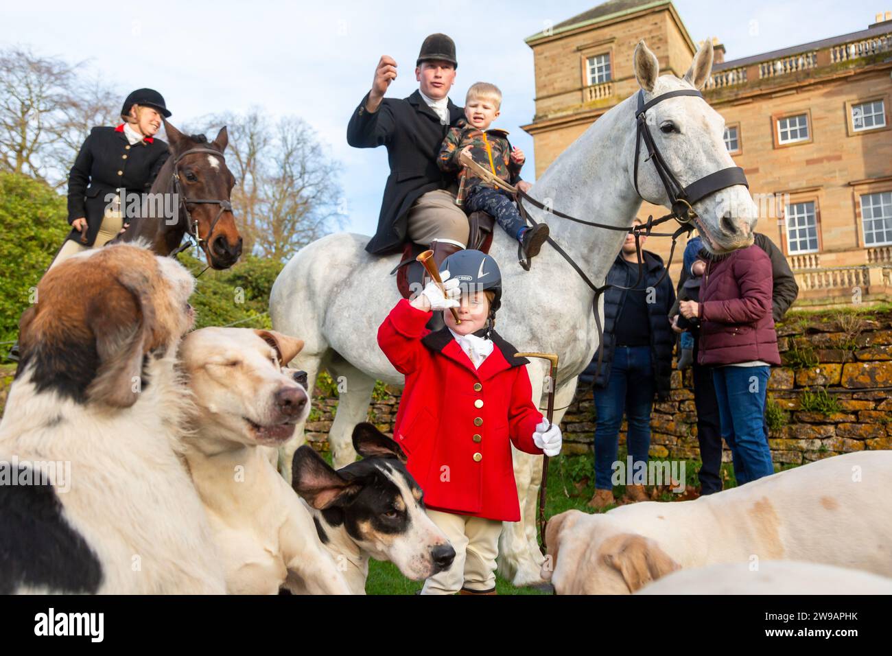 Hagley, Worcestershire, UK. 26th Dec, 2023. 4 year old Myla Mills blows her horn among the hunt riders and hounds at Albrighton and Woodland Hunt's Boxing Day meet at Hagley Hall, Worcestershire. Credit: Peter Lopeman/Alamy Live News Stock Photo