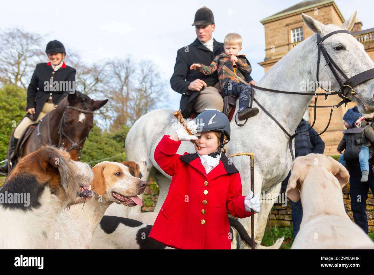 Hagley, Worcestershire, UK. 26th Dec, 2023. 4 year old Myla Mills blows her horn among the hunt riders and hounds at Albrighton and Woodland Hunt's Boxing Day meet at Hagley Hall, Worcestershire. Credit: Peter Lopeman/Alamy Live News Stock Photo