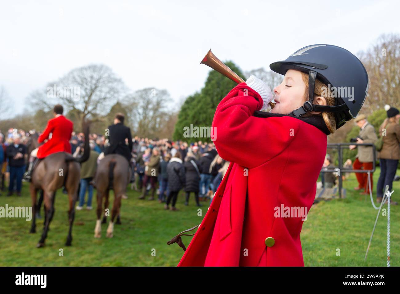 Hagley, Worcestershire, UK. 26th Dec, 2023. 4 year old Myla Mills blows her horn for the hunt riders and hounds at the Albrighton and Woodland Hunt's Boxing Day meet at Hagley Hall, Worcestershire. Credit: Peter Lopeman/Alamy Live News Stock Photo