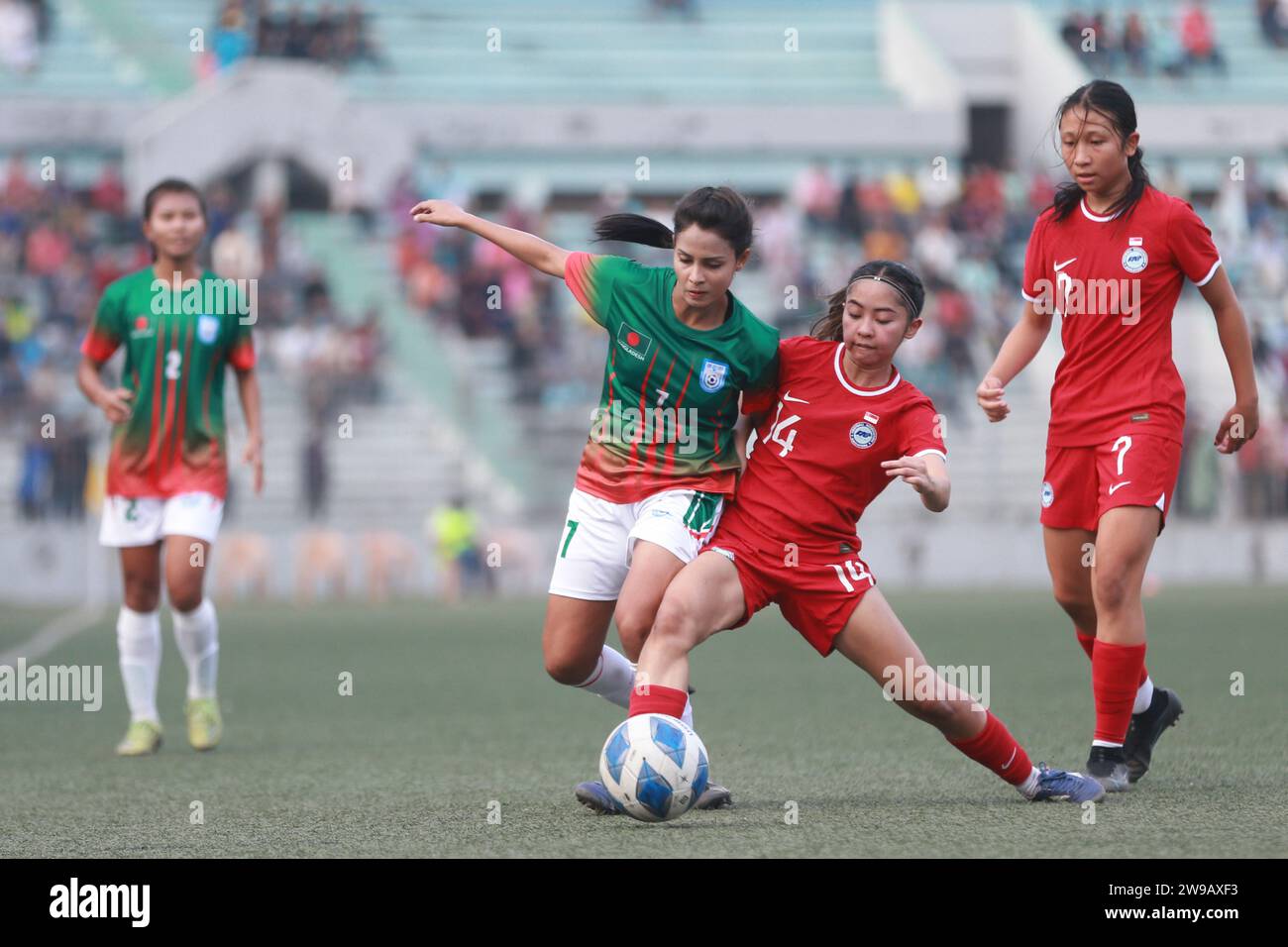 Bangladeshi midfilder Sanjida Akhter (2nd left) try to take control as Bangladesh national women's team capped off their FIFA friendly window with a t Stock Photo