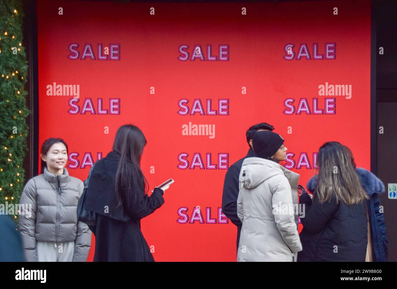 London, UK. 26th December 2023. Customers queue outside Selfridges on