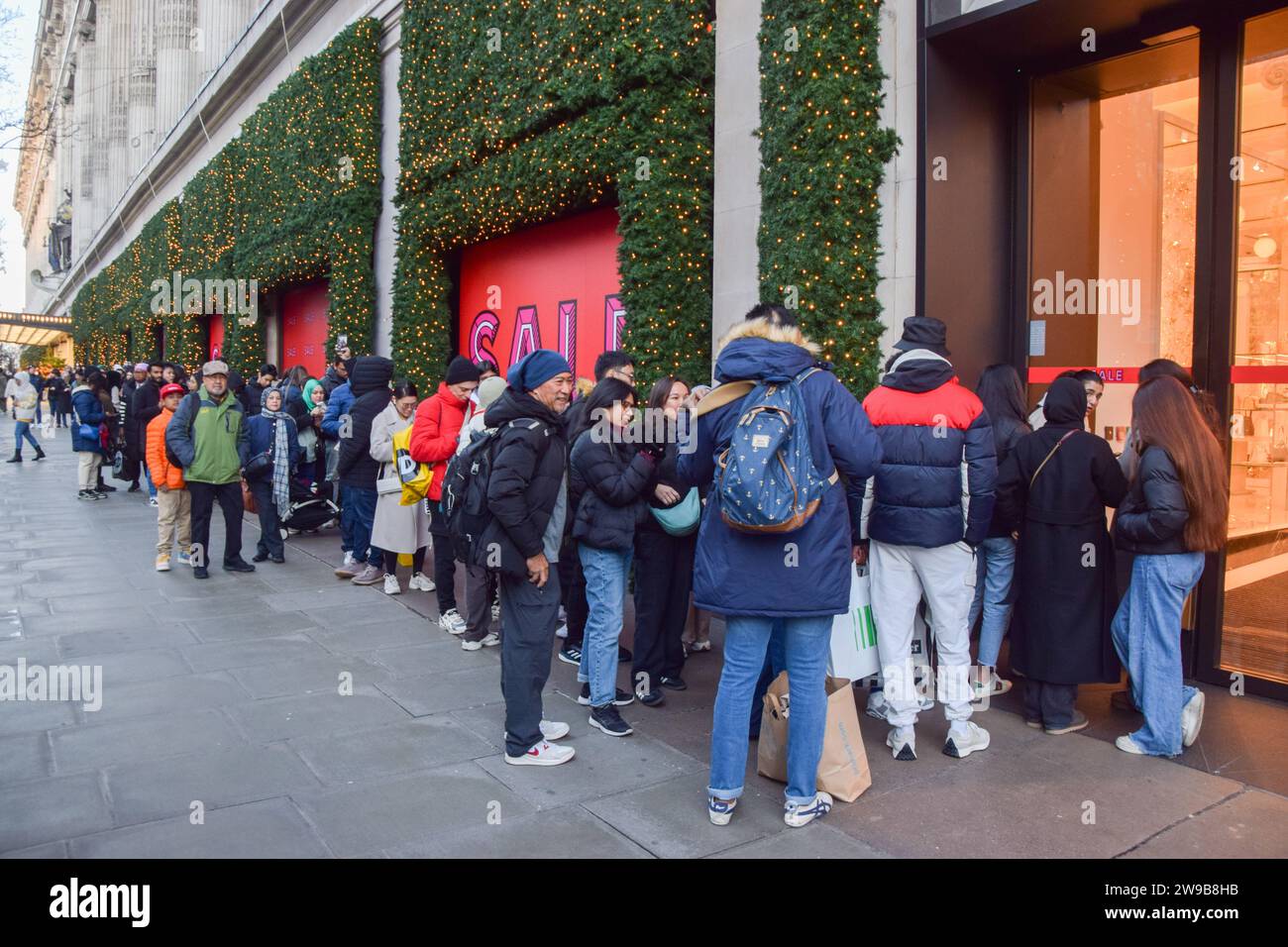 London, UK. 26th December 2023. Customers queue outside Selfridges on