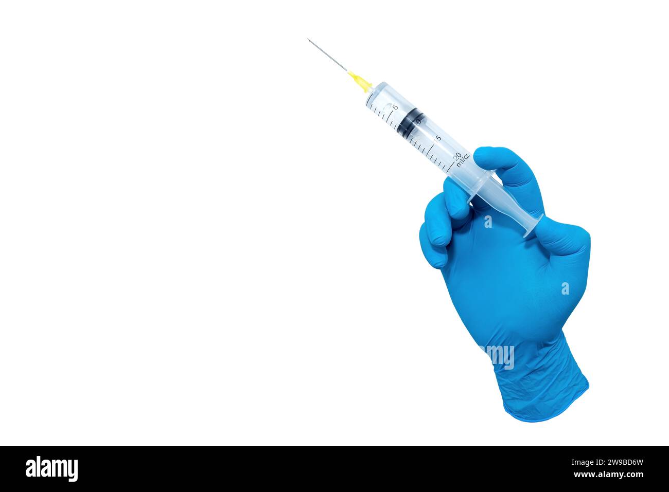 A hand in blue rubber gloves holds a medical syringe with a needle on a