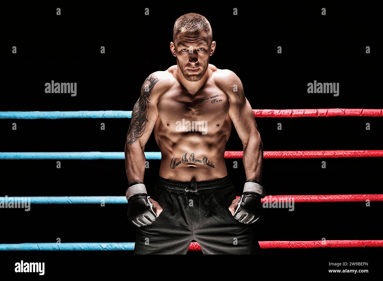Mixed martial artist posing in boxing ring. Concept of mma, ufc, thai