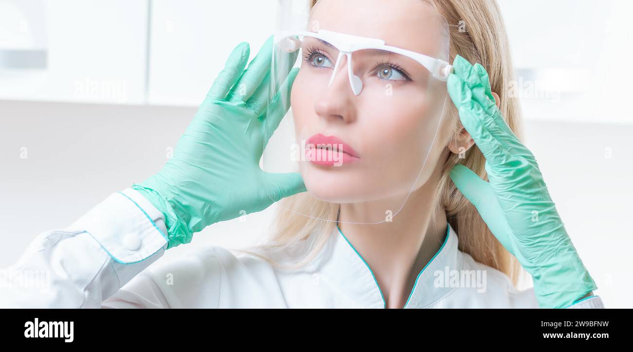 Portrait of a girl in a protective mask. Concept of cosmetology, plastic surgery, beauty industry. Mixed media Stock Photo