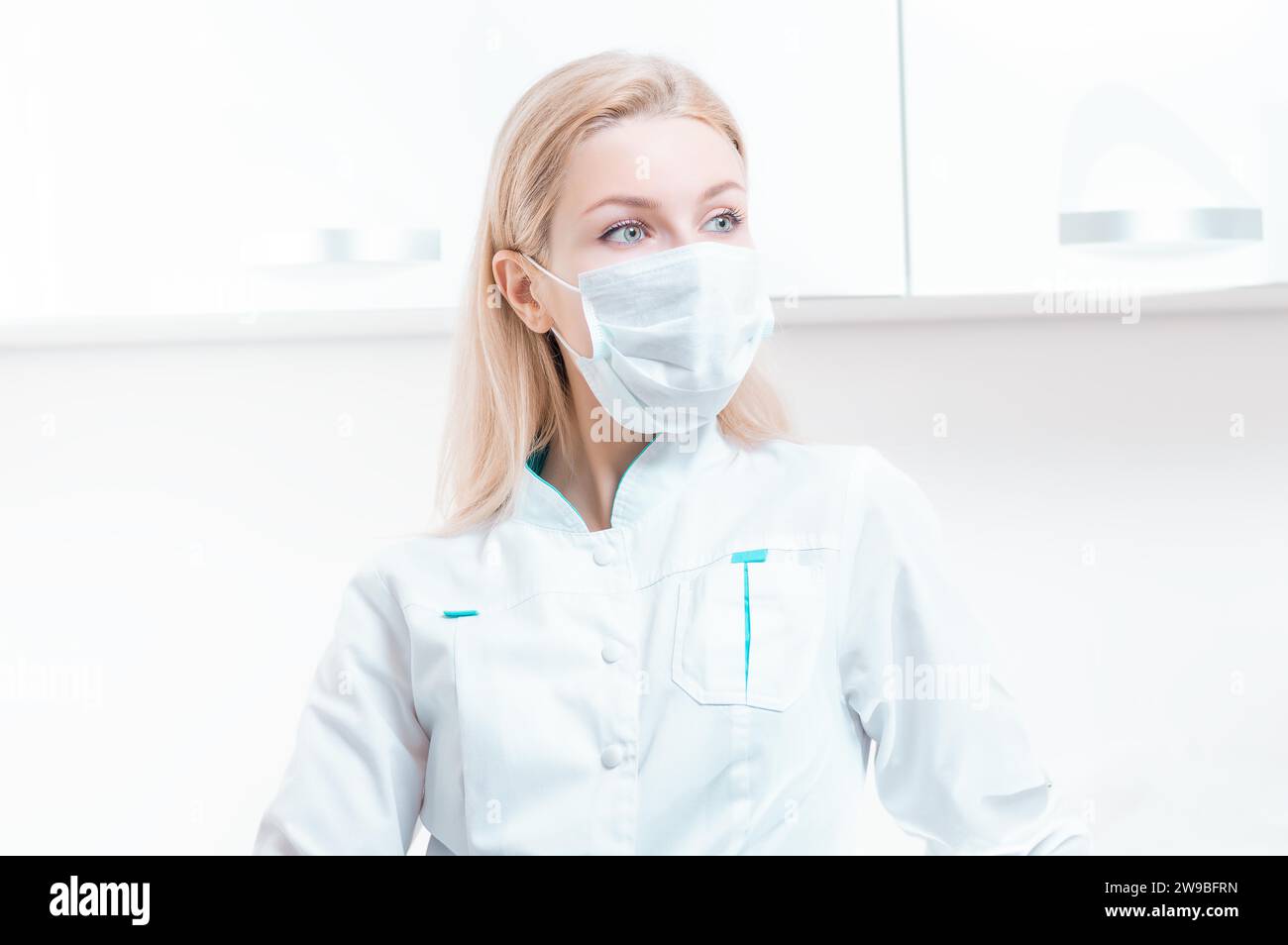 Portrait of a girl in a protective mask. Concept of cosmetology, plastic surgery, beauty industry. Mixed media Stock Photo