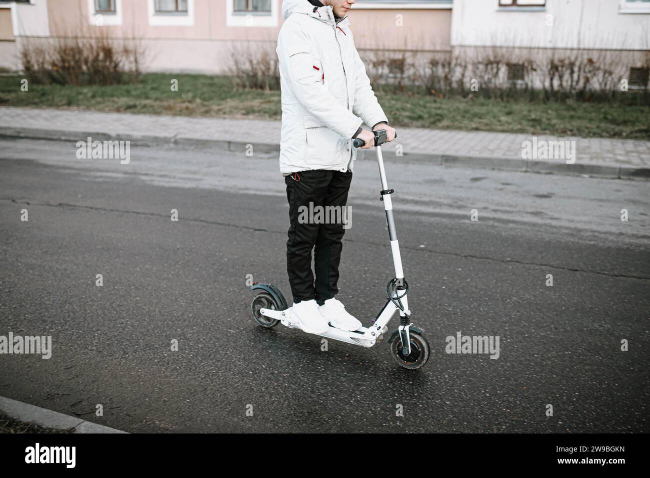 Male rides electric scooter hi-res stock photography and images - Alamy